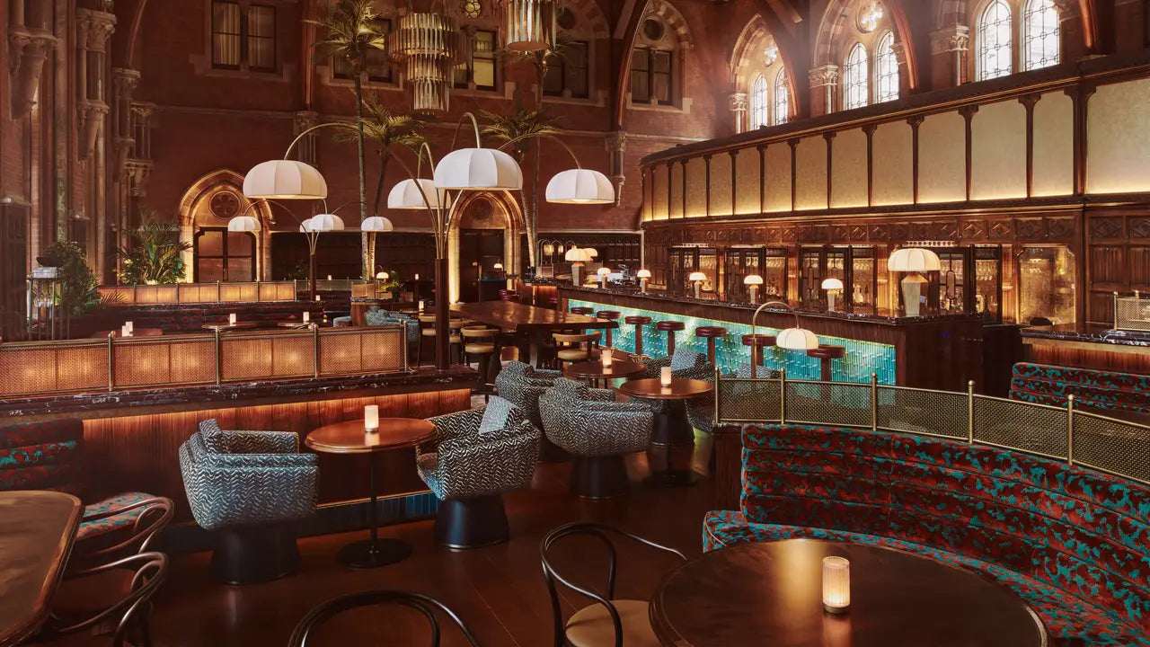 Luxurious interior of a restaurant with high ceilings, chandeliers, at Dent London.