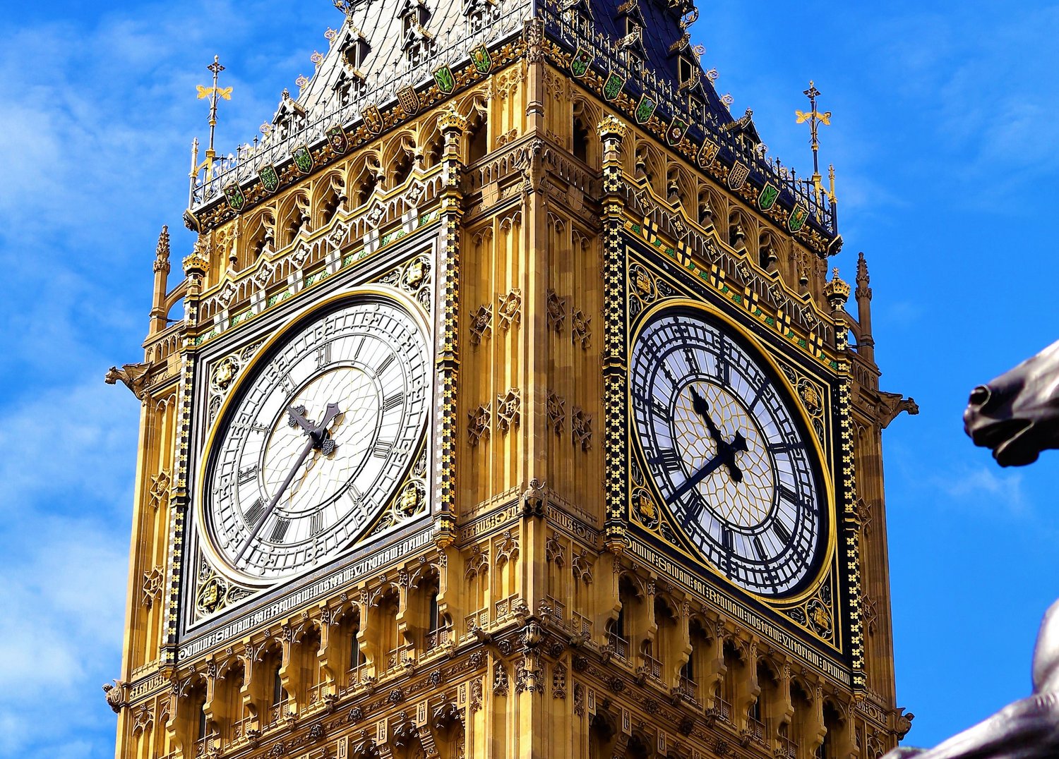 Close-up of the Elizabeth Tower, also known as Big Ben, against a blue sky made by Dent London